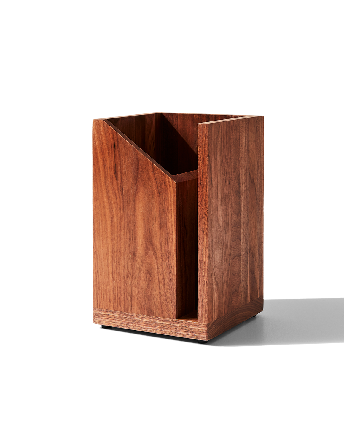 A wooden utensil holder with a slot for organizing kitchen tools, featuring a hidden magnet.